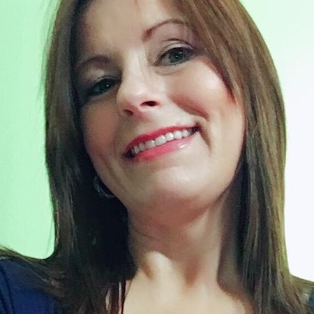 Laura E.